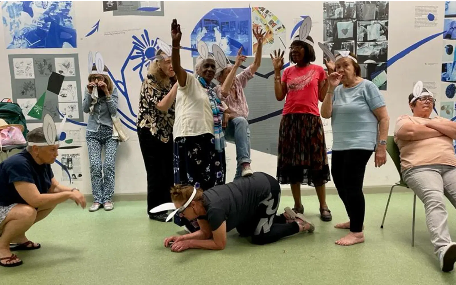 9 people (60+) rehearsing a play (The Glass Flower Society)
